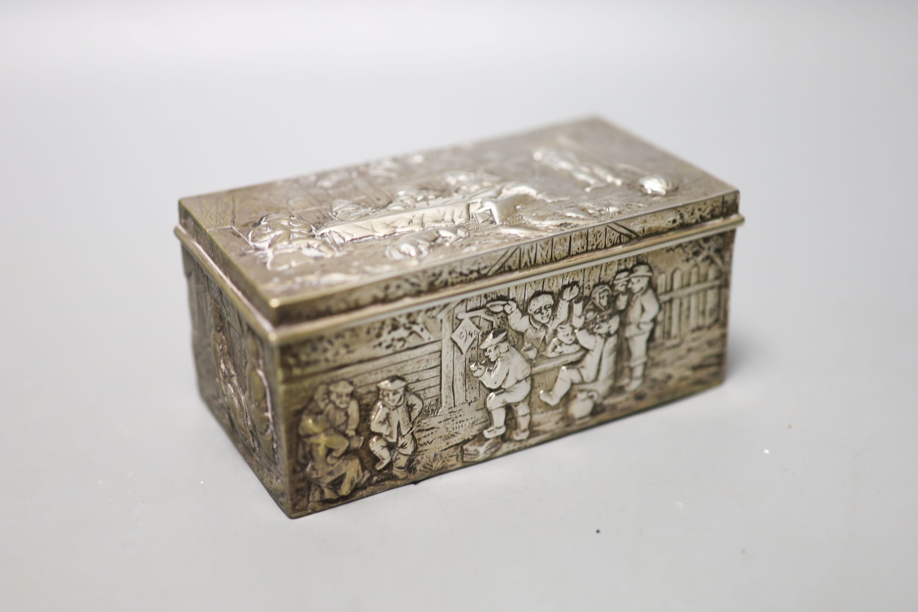 A late 19th century German embossed 800 standard white metal rectangular box, 12.2cm, three smaller boxes, including two silver and a match sleeve.